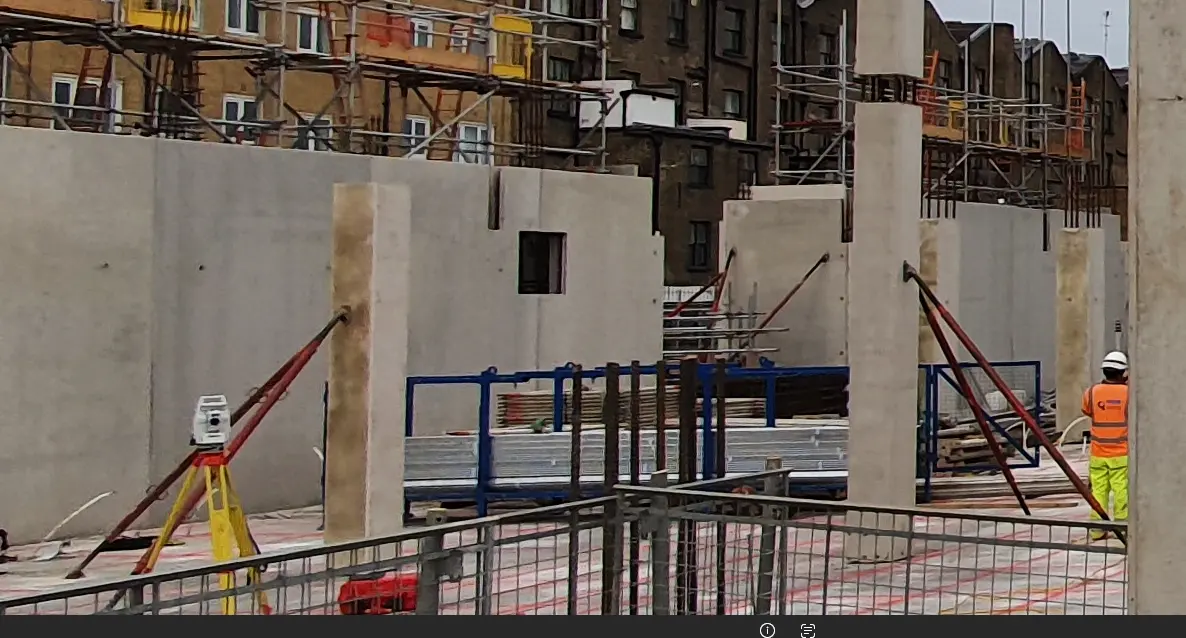 Precast columns supported by temporary braces on a construction site